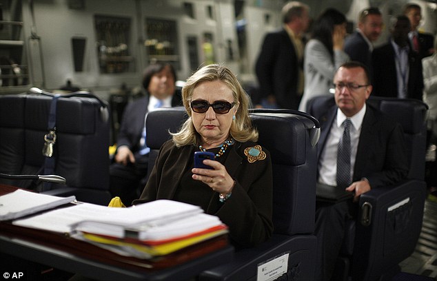 ICONIC OR IRONIC? The image of Clinton working her Blackberry while on a plane en route to Tripoli, Libya took on new significance with her admission that she never used a 